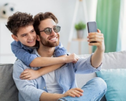 Father and son taking a selfie
